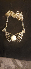 Skeleton Hands with Glowing Orb Necklace