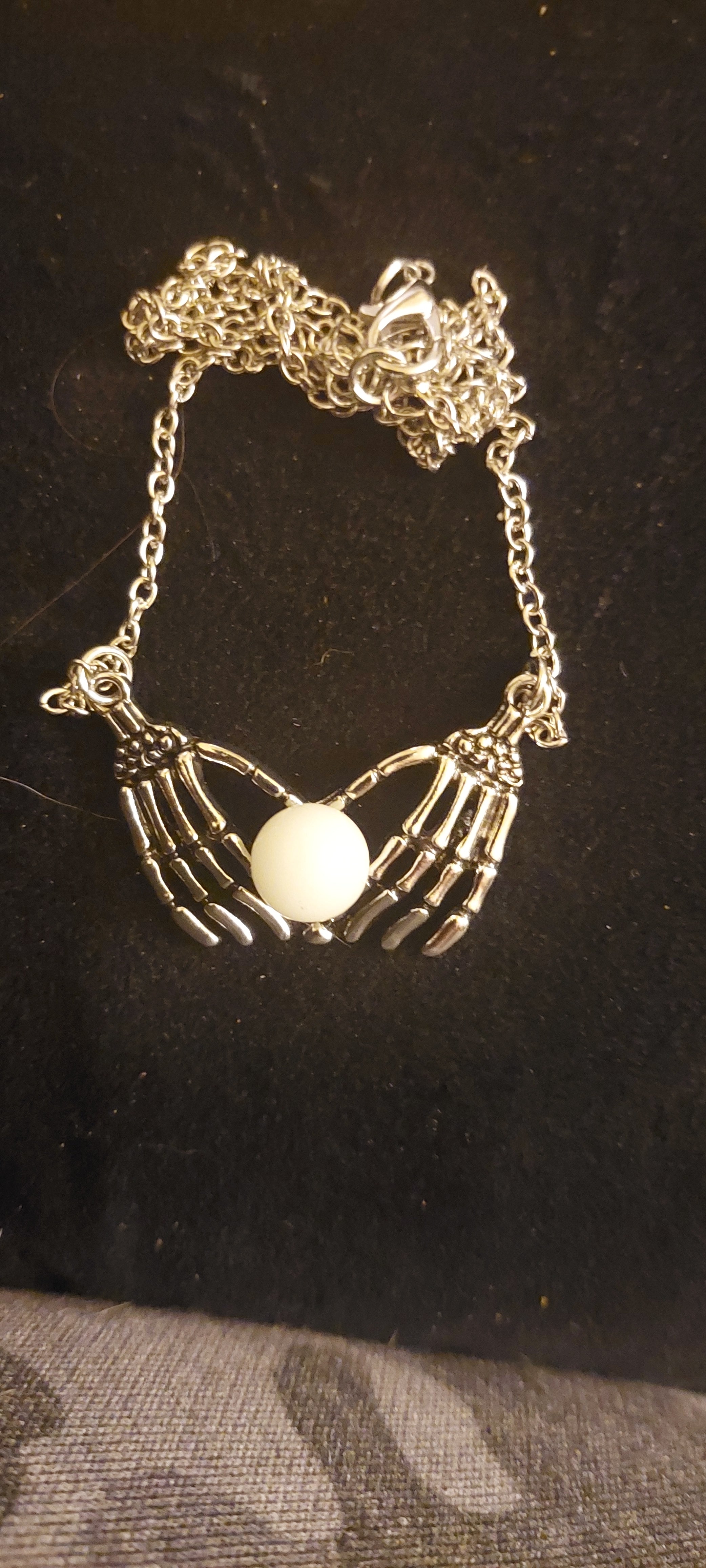 Skeleton Hands with Glowing Orb Necklace